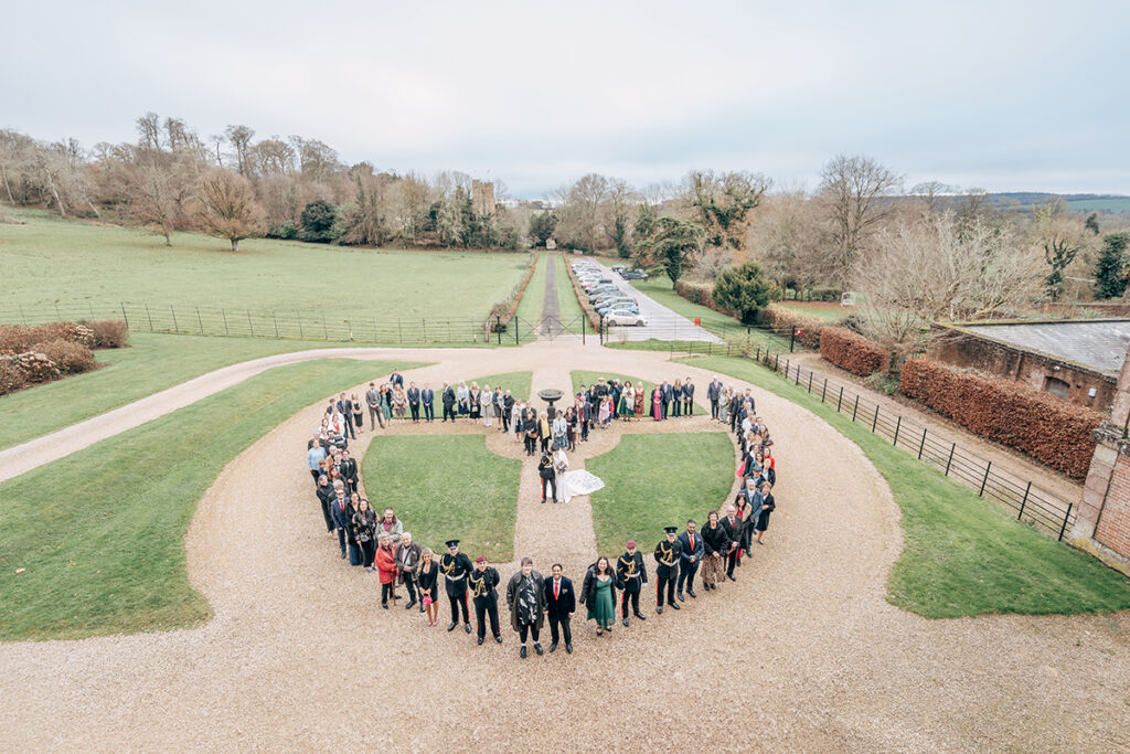 Guests shaped in a heart at miltary wedding at Crowcombe Court. December 2023